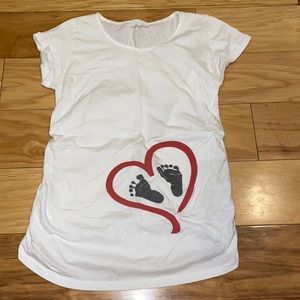 Maternity white tee heart around baby foot prints on the belly